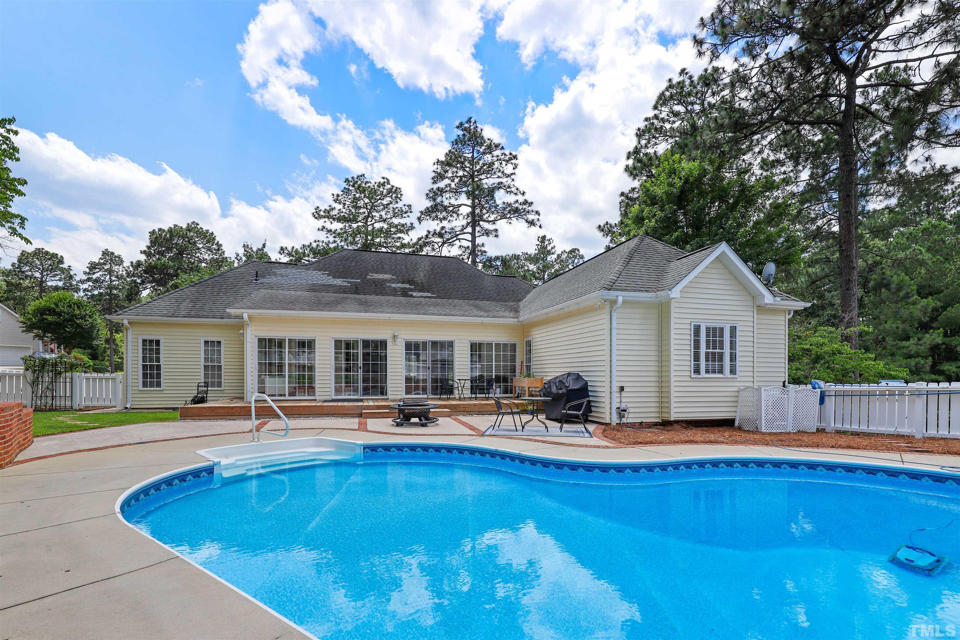 655 Elk Road Southern Pines, NC 28387 - Photo 35 of 45 a front view of house with yard swimming pool and seating space