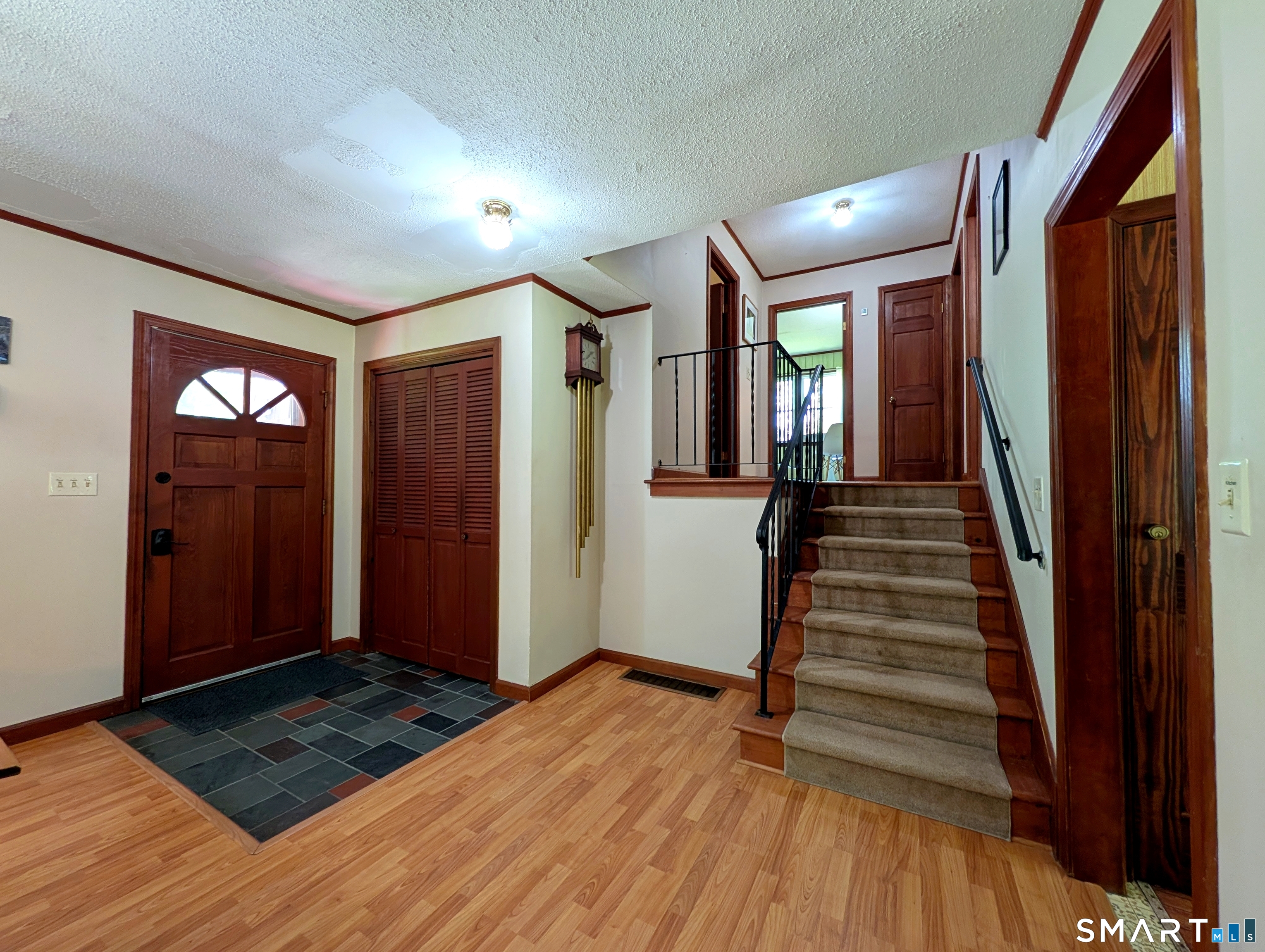 17 Colebrook Road Norfolk, CT 06058 - Photo 7 of 21 a view of entryway with wooden floor and stairs