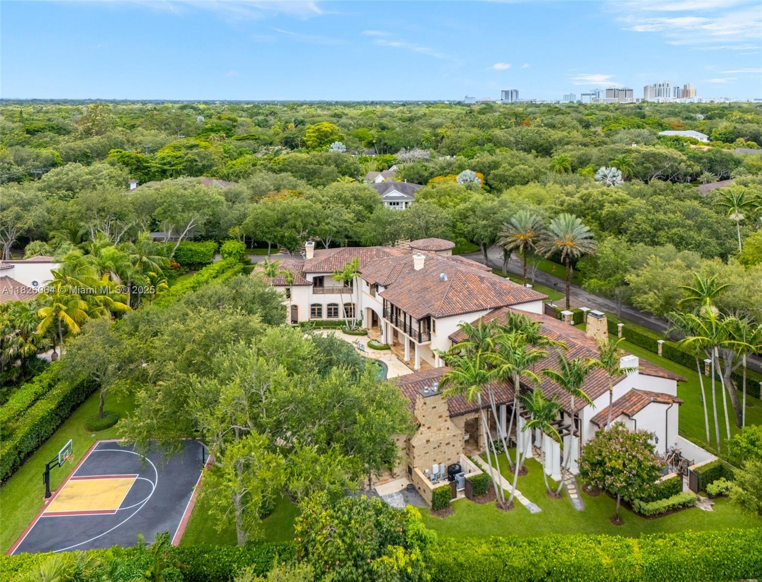 10101 Southwest 60th Court Pinecrest, FL 33156 - Photo 16 of 98 an aerial view of residential houses with outdoor space and trees