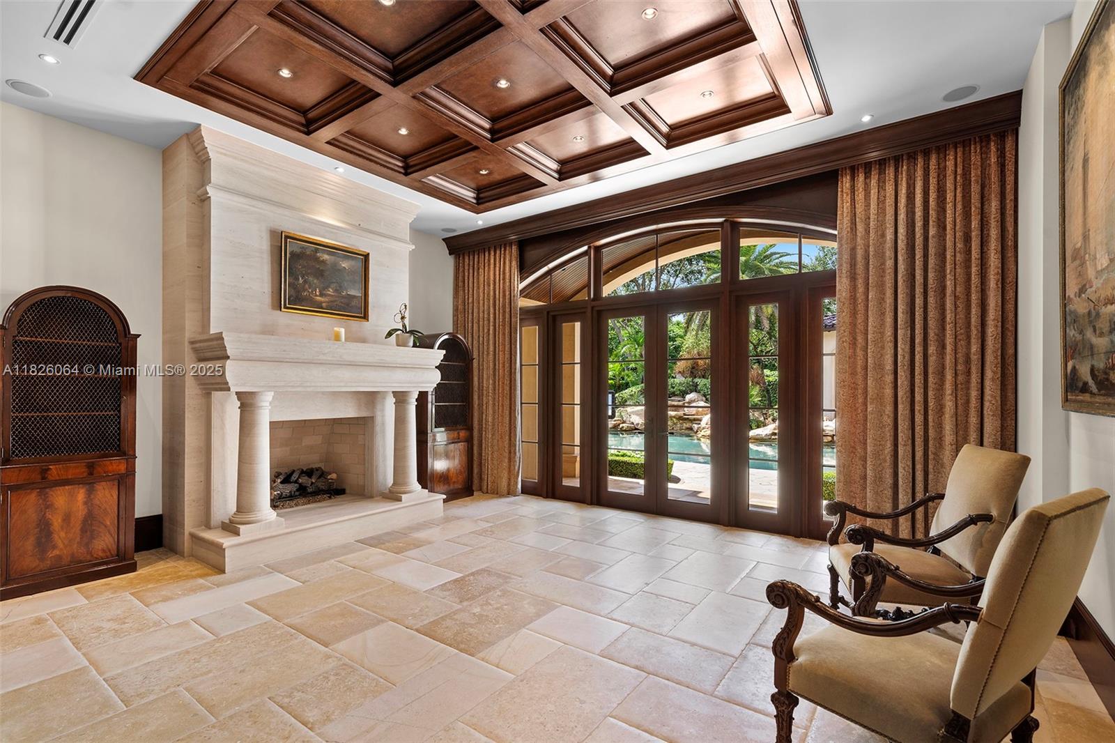 10101 Southwest 60th Court Pinecrest, FL 33156 - Photo 19 of 98 a living room with furniture and a fireplace