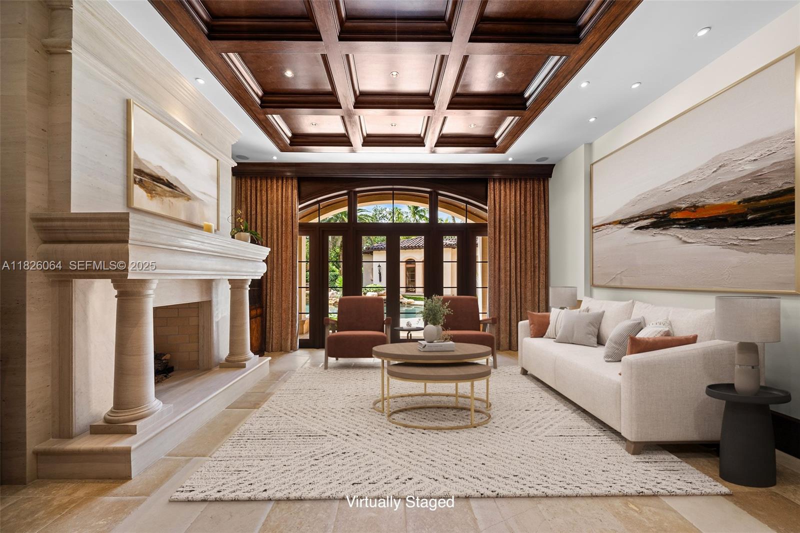 10101 Southwest 60th Court Pinecrest, FL 33156 - Photo 20 of 98 a living room with furniture and a fireplace