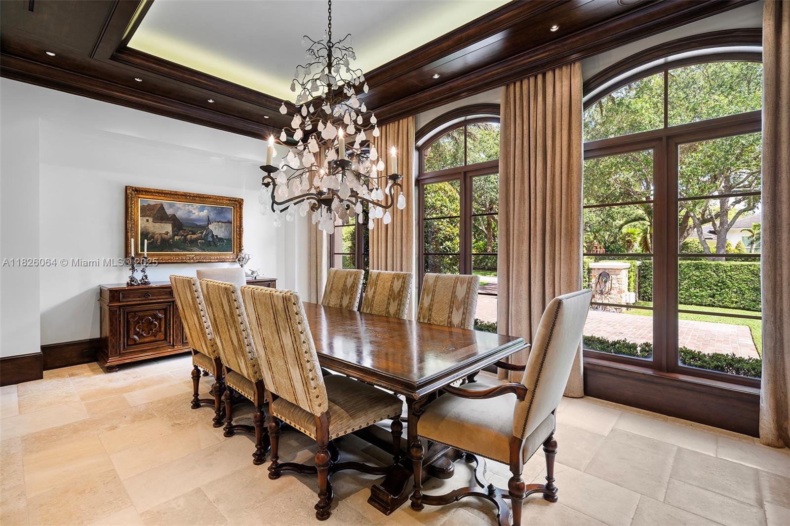 10101 Southwest 60th Court Pinecrest, FL 33156 - Photo 24 of 98 a view of a dining room with furniture and a chandelier