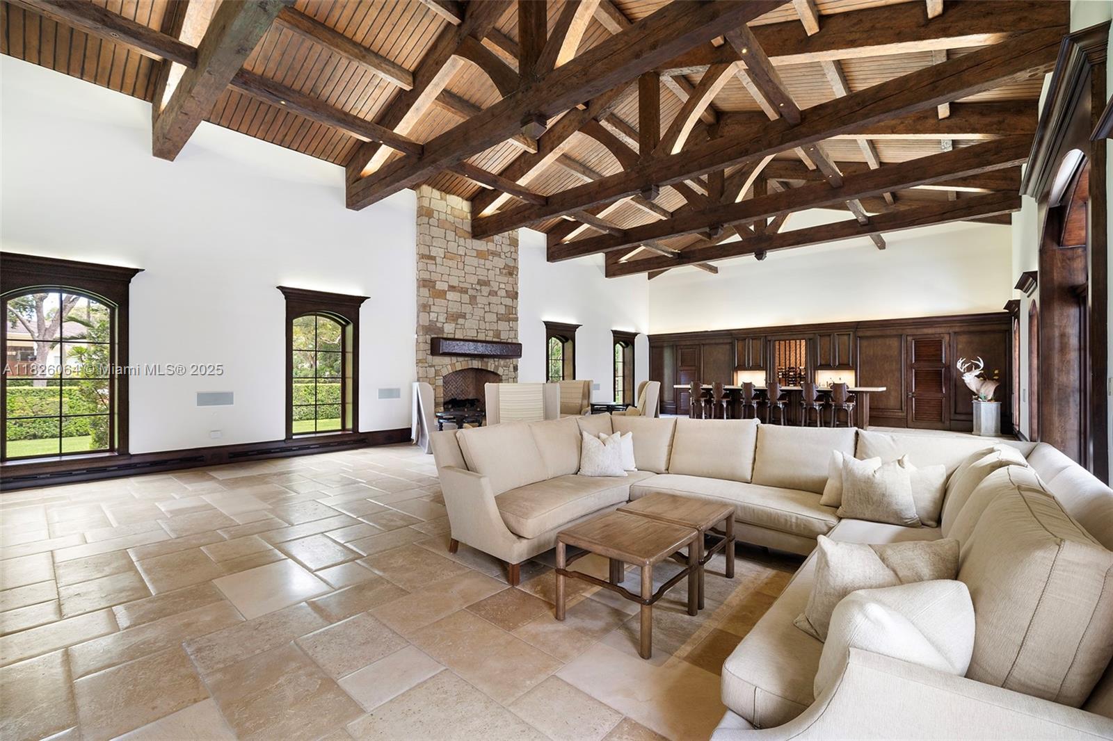 10101 Southwest 60th Court Pinecrest, FL 33156 - Photo 29 of 98 a living room with furniture a ceiling fan and a rug