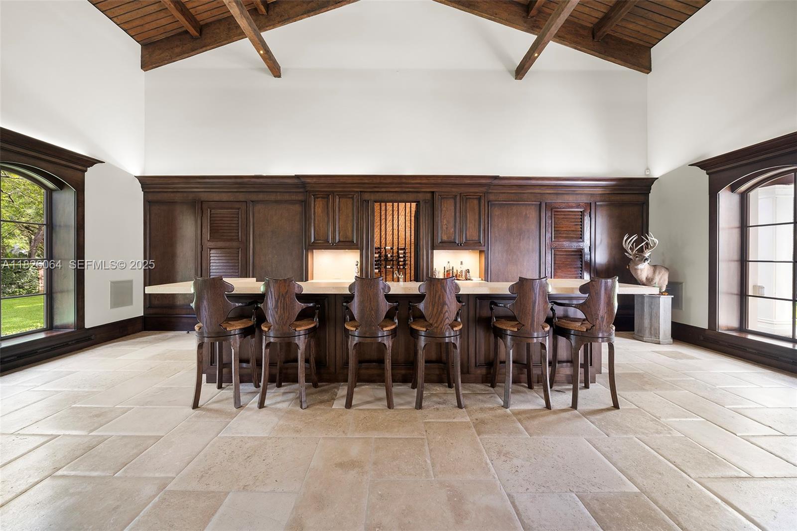 10101 Southwest 60th Court Pinecrest, FL 33156 - Photo 32 of 98 a group of people sitting in center of a building