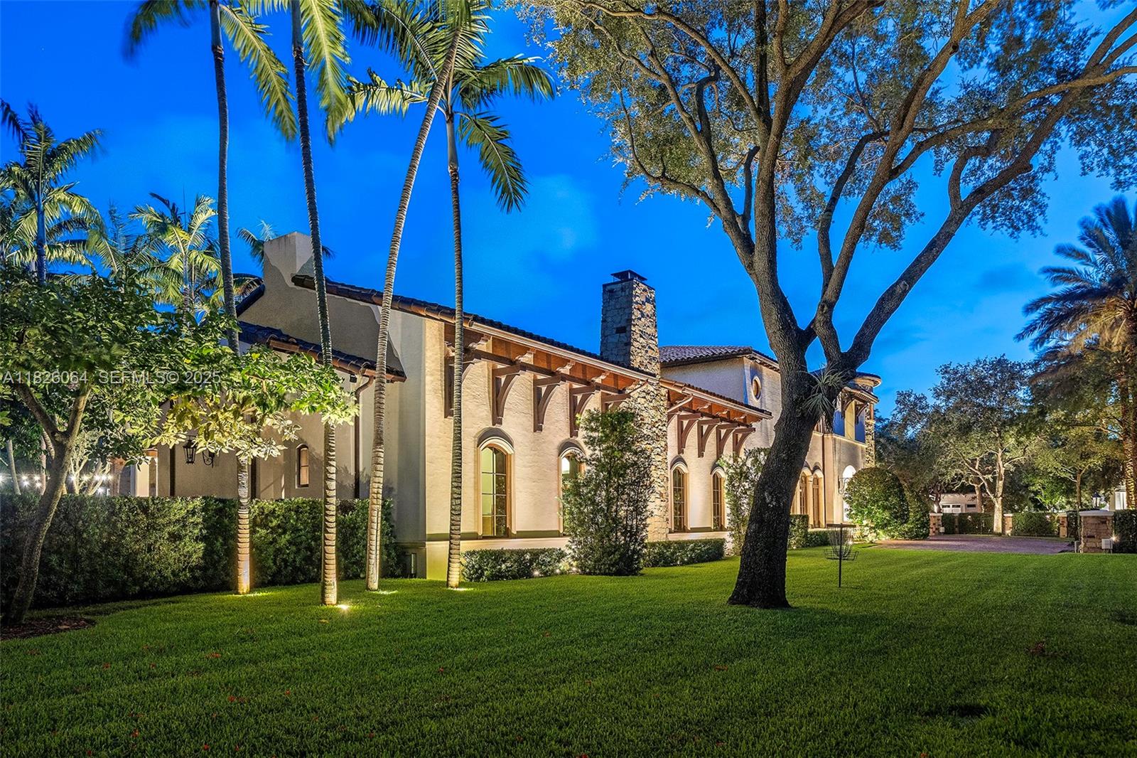 10101 Southwest 60th Court Pinecrest, FL 33156 - Photo 4 of 98 a view of a house with a yard