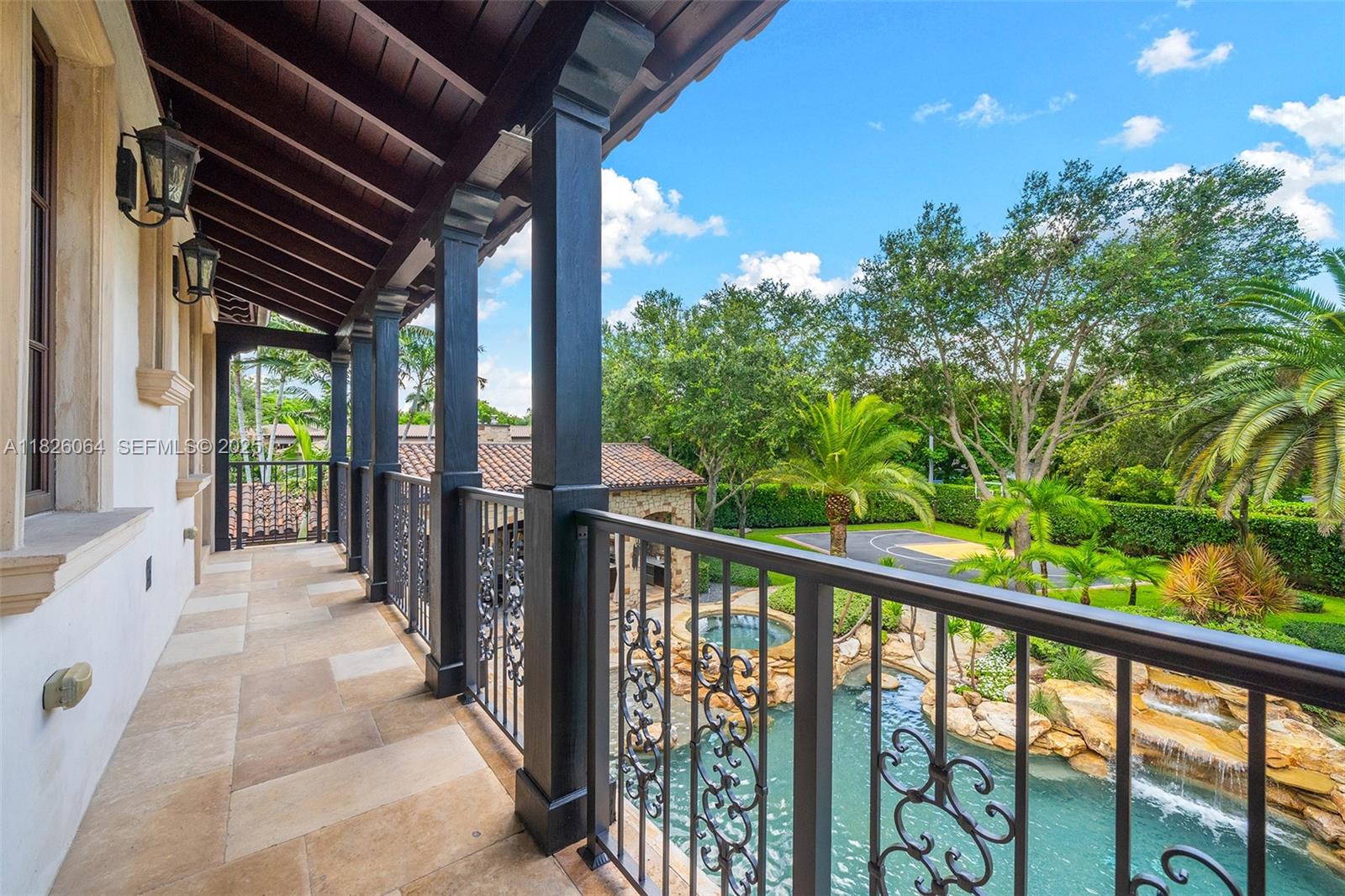 10101 Southwest 60th Court Pinecrest, FL 33156 - Photo 52 of 98 a view of balcony with wooden floor