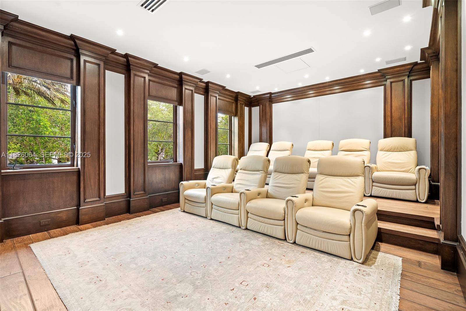 10101 Southwest 60th Court Pinecrest, FL 33156 - Photo 54 of 98 a living room with furniture and large windows