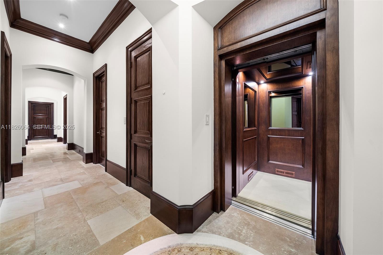 10101 Southwest 60th Court Pinecrest, FL 33156 - Photo 56 of 98 a view of a hallway with wooden floor and entryway