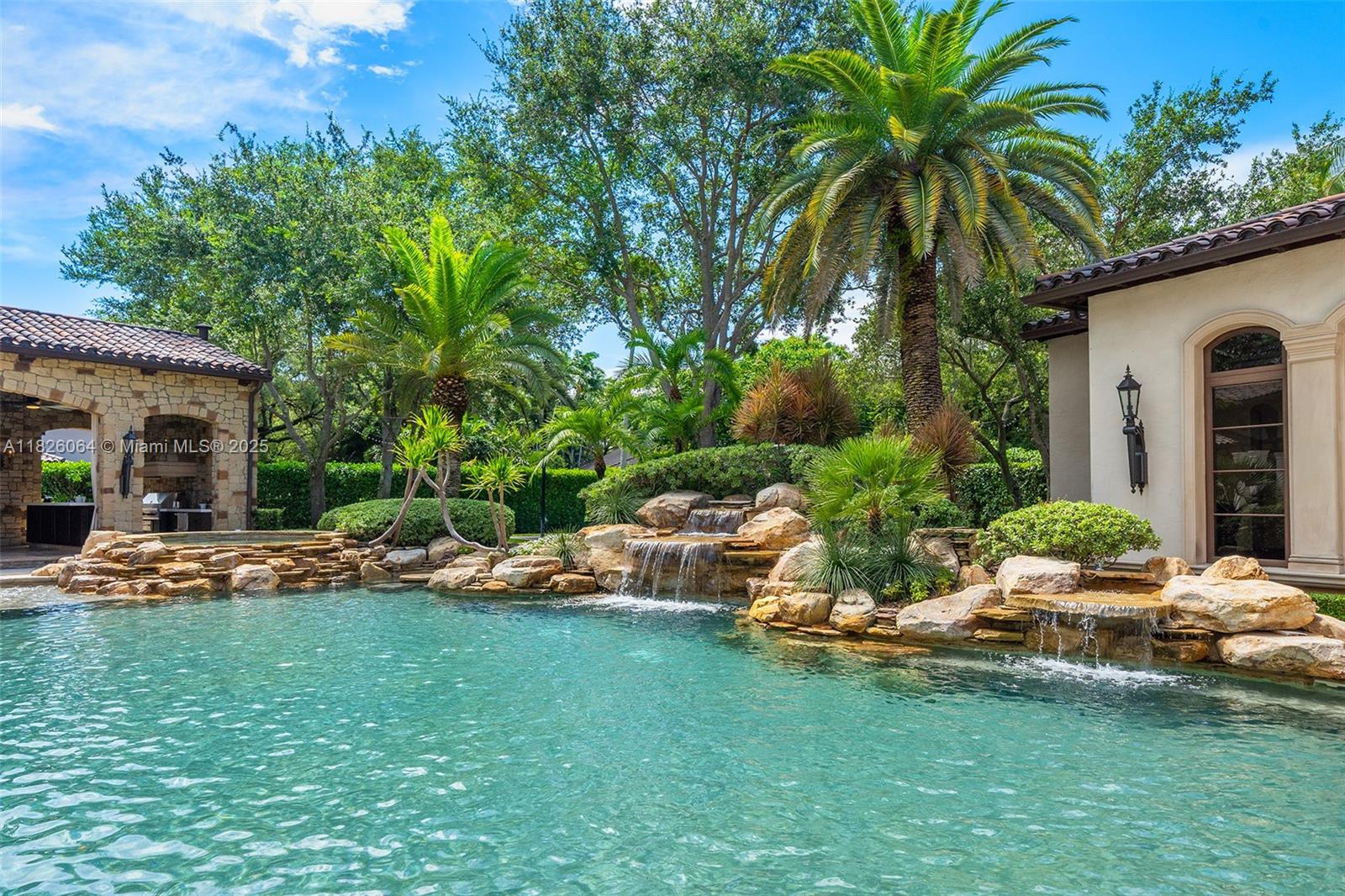 10101 Southwest 60th Court Pinecrest, FL 33156 - Photo 74 of 98 a view of a house with backyard and sitting area