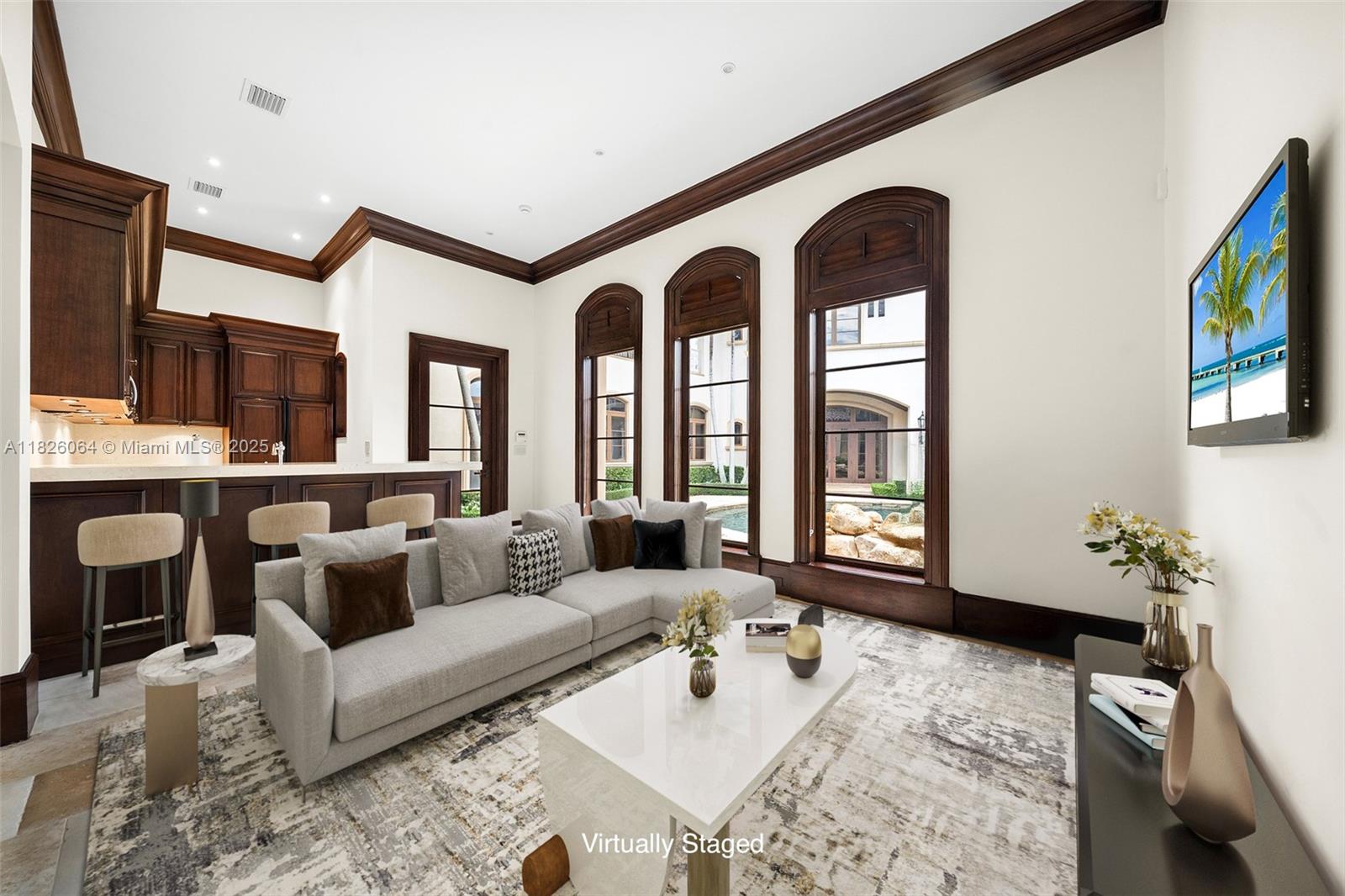 10101 Southwest 60th Court Pinecrest, FL 33156 - Photo 80 of 98 a living room with furniture fireplace and flat screen tv