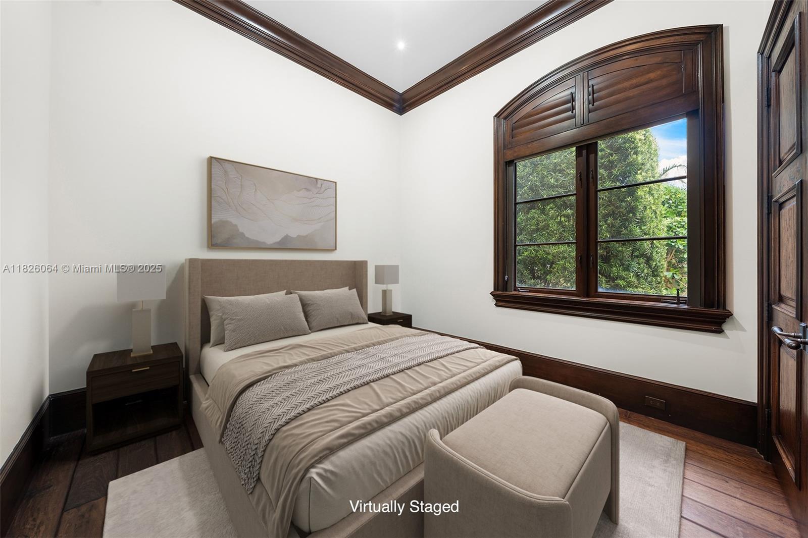 10101 Southwest 60th Court Pinecrest, FL 33156 - Photo 85 of 98 a bedroom with a bed and a large window