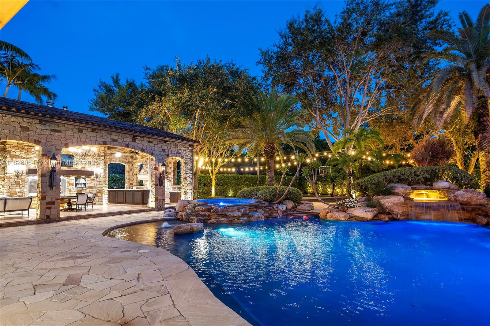 10101 Southwest 60th Court Pinecrest, FL 33156 - Photo 89 of 98 a front view of a house with a yard