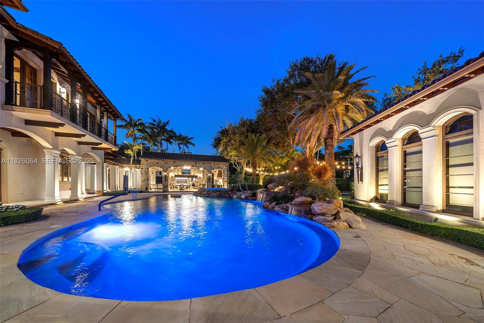 10101 Southwest 60th Court Pinecrest, FL 33156 - Photo 90 of 98 a view of a swimming pool with outdoor seating