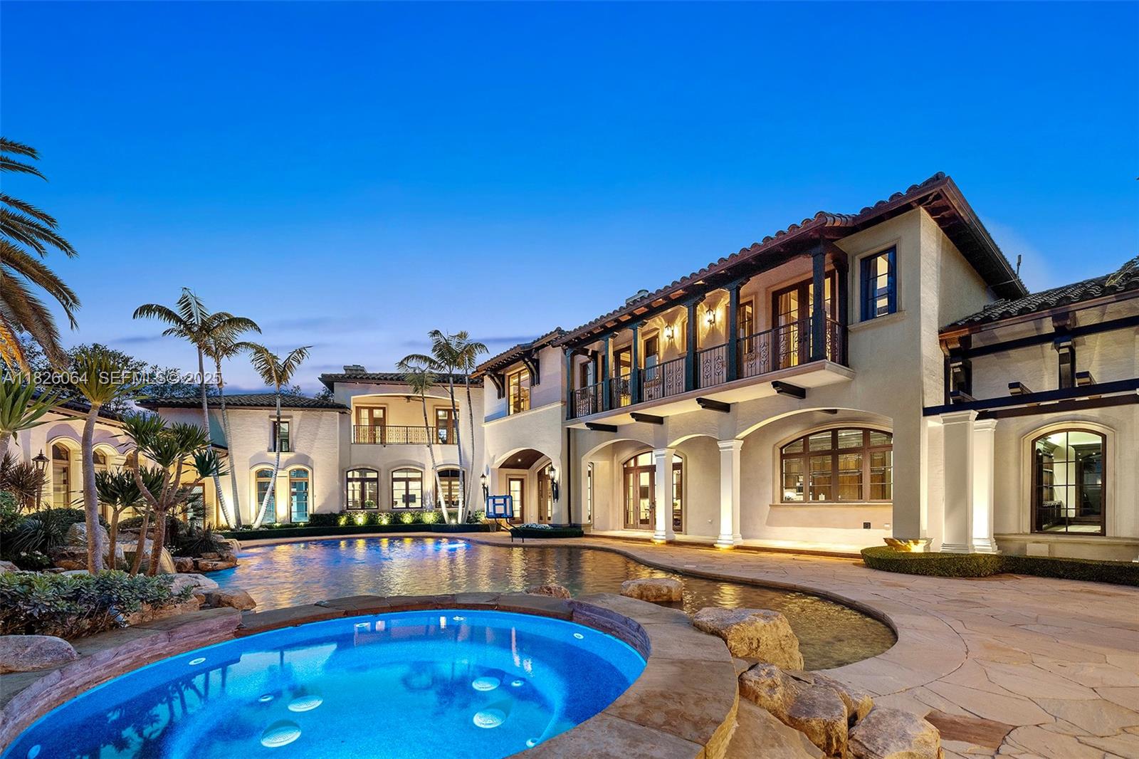 10101 Southwest 60th Court Pinecrest, FL 33156 - Photo 92 of 98 a view of a building with a swimming pool