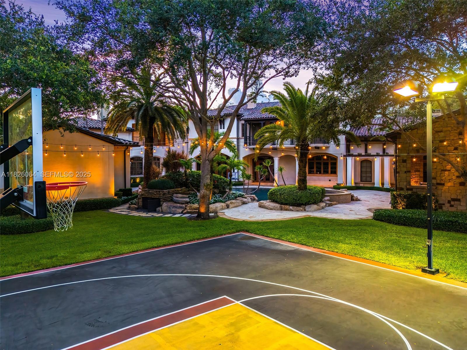10101 Southwest 60th Court Pinecrest, FL 33156 - Photo 94 of 98 a view of a swimming pool with a lawn chairs next to a road