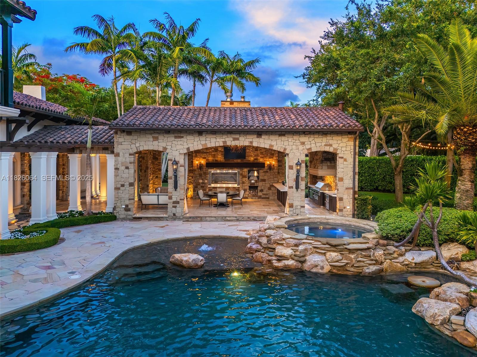 10101 Southwest 60th Court Pinecrest, FL 33156 - Photo 95 of 98 a view of a house with backyard and sitting area