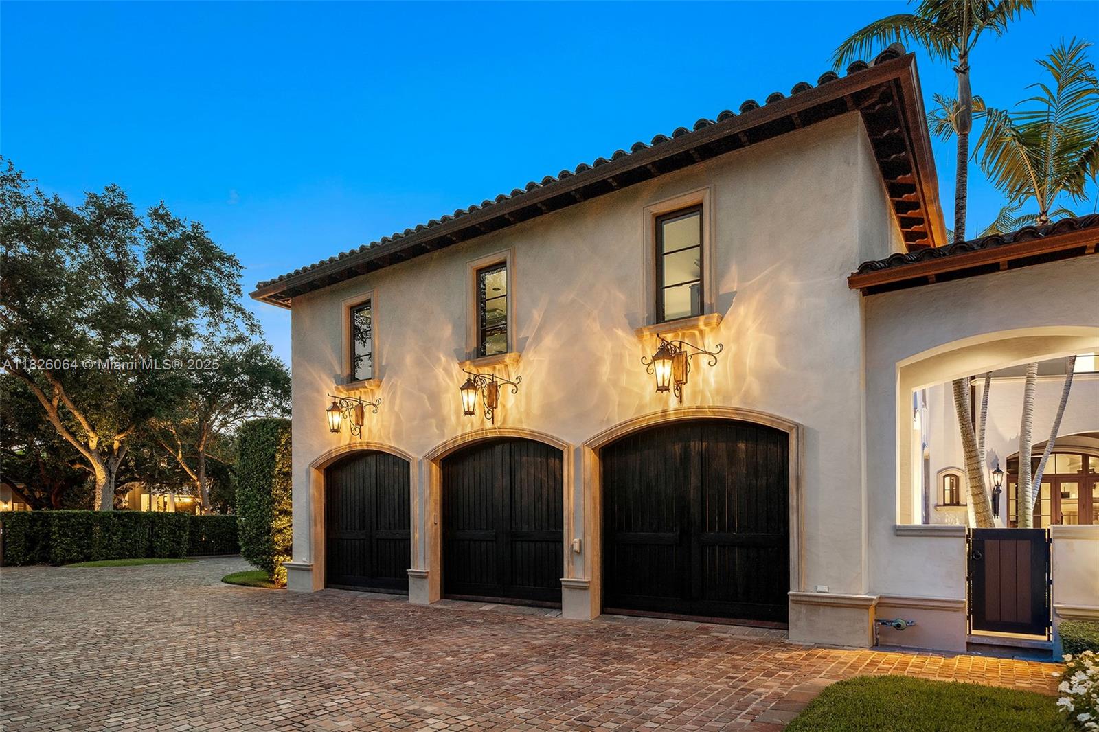10101 Southwest 60th Court Pinecrest, FL 33156 - Photo 10 of 98 a front view of a house with parking space