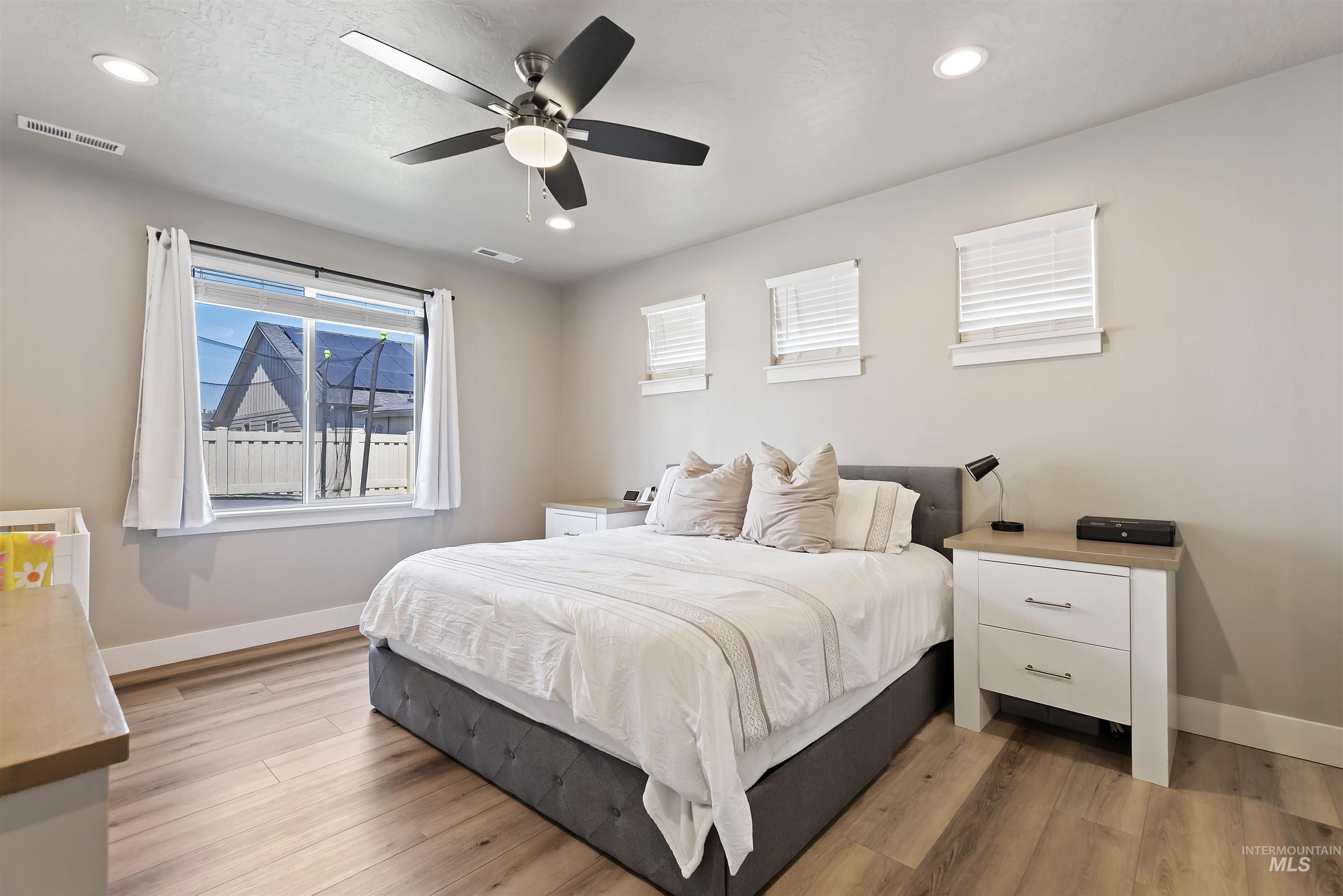 654 Diamond Lake Street Middleton, ID 83644 - Photo 16 of 36 Bedroom featuring light wood finished floors, ceiling fan, and recessed lighting