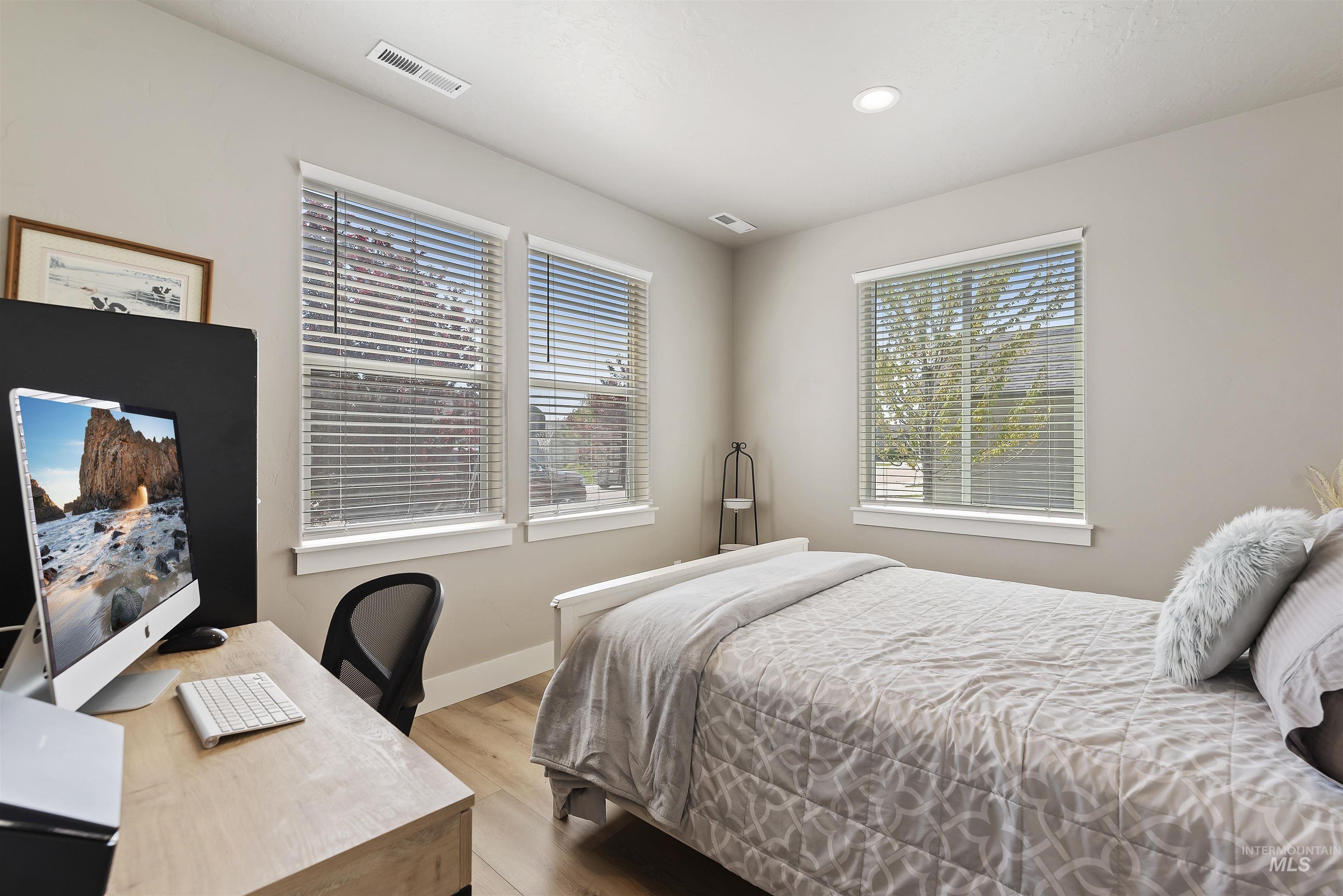 654 Diamond Lake Street Middleton, ID 83644 - Photo 19 of 36 Bedroom featuring an office area, light wood-style flooring, and recessed lighting