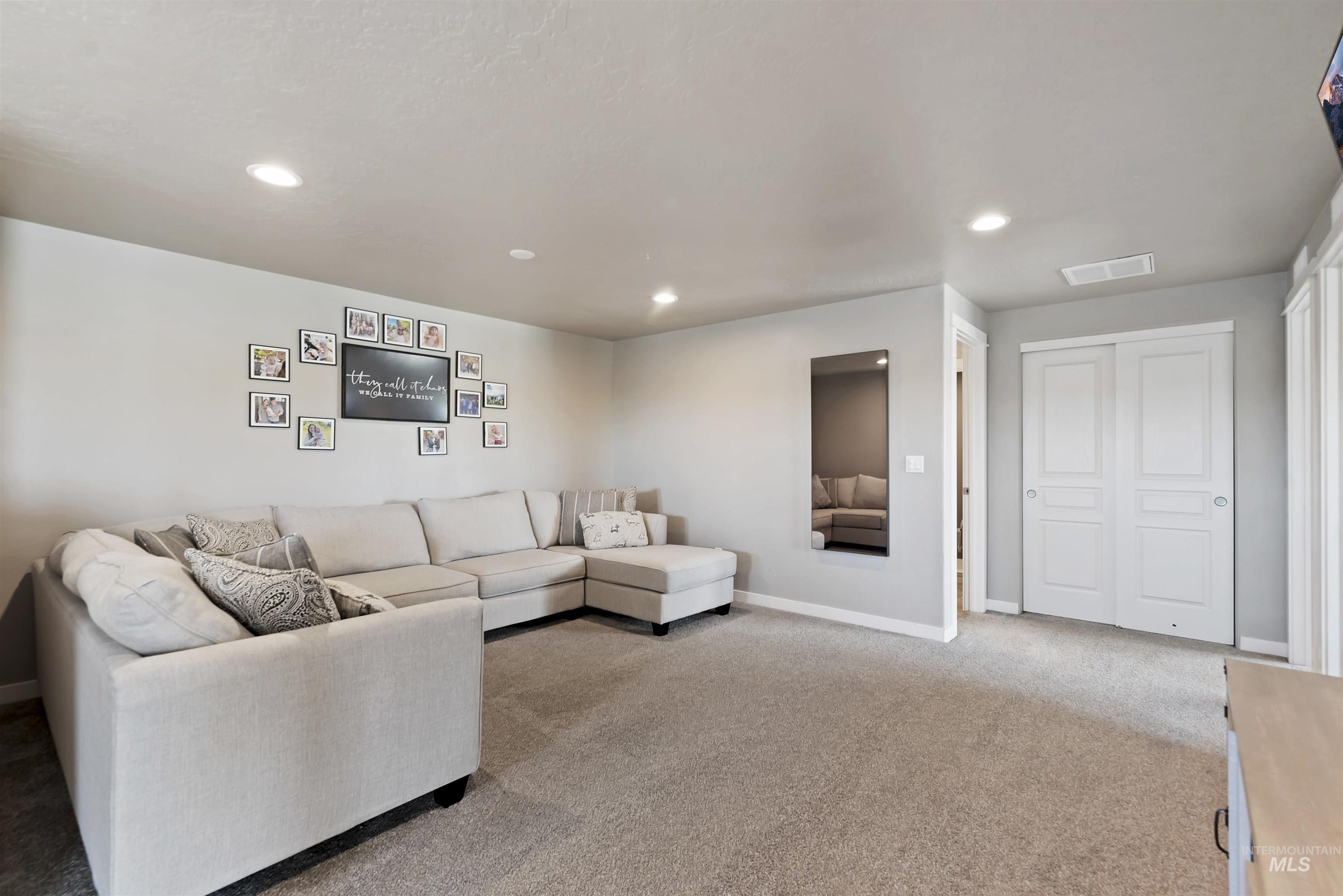 654 Diamond Lake Street Middleton, ID 83644 - Photo 23 of 36 Living room featuring carpet floors and recessed lighting