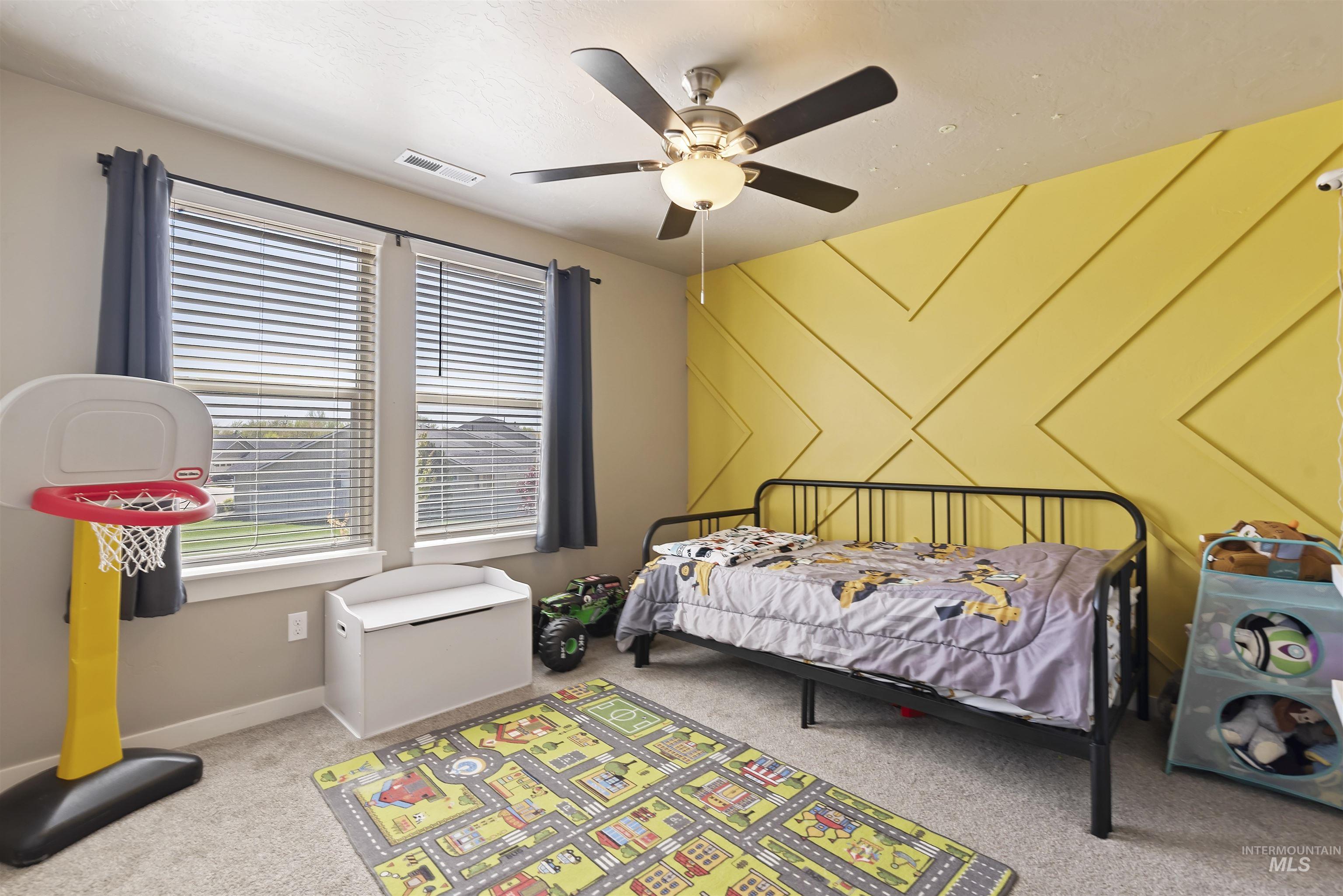 654 Diamond Lake Street Middleton, ID 83644 - Photo 27 of 36 Bedroom featuring an accent wall, light colored carpet, and ceiling fan