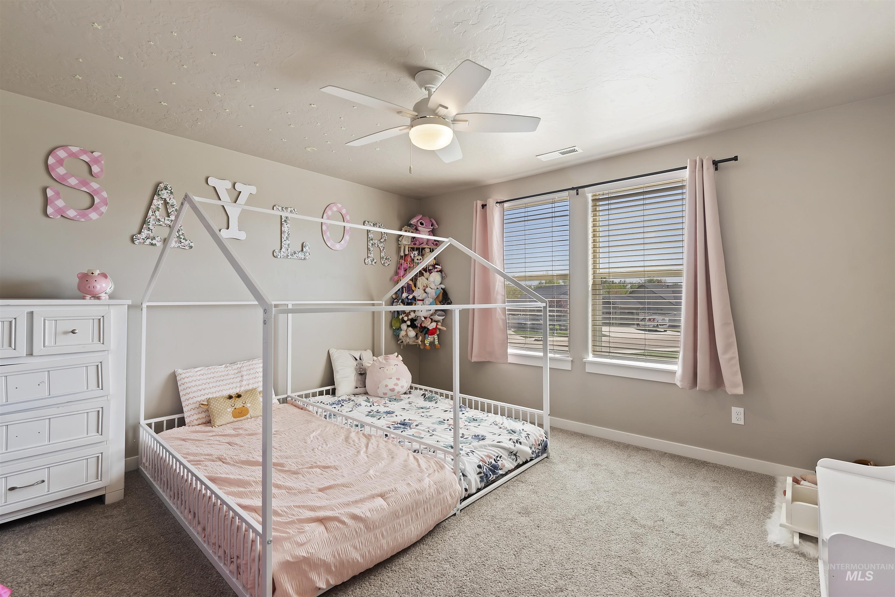 654 Diamond Lake Street Middleton, ID 83644 - Photo 28 of 36 Bedroom featuring light colored carpet and a ceiling fan