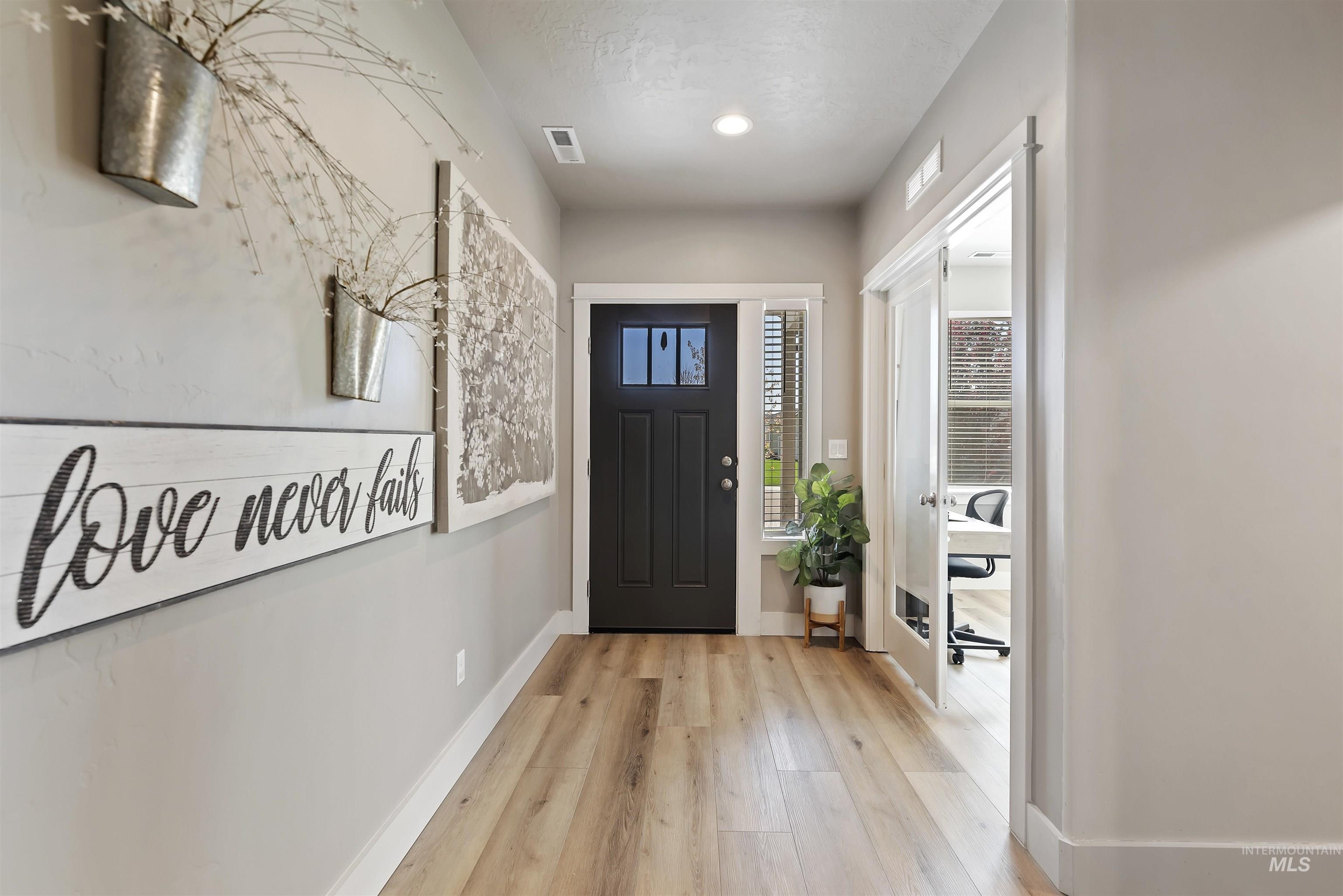 654 Diamond Lake Street Middleton, ID 83644 - Photo 3 of 36 Foyer entrance with light wood-type flooring and baseboards