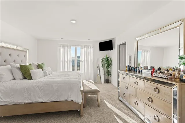 a living room with furniture and a large mirror