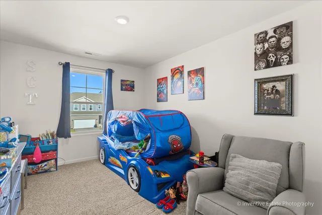 a bedroom with furniture and a couch