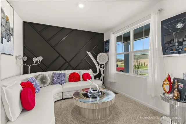 a living room with furniture and a closet