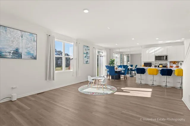 a view of a living room and kitchen with furniture and a table