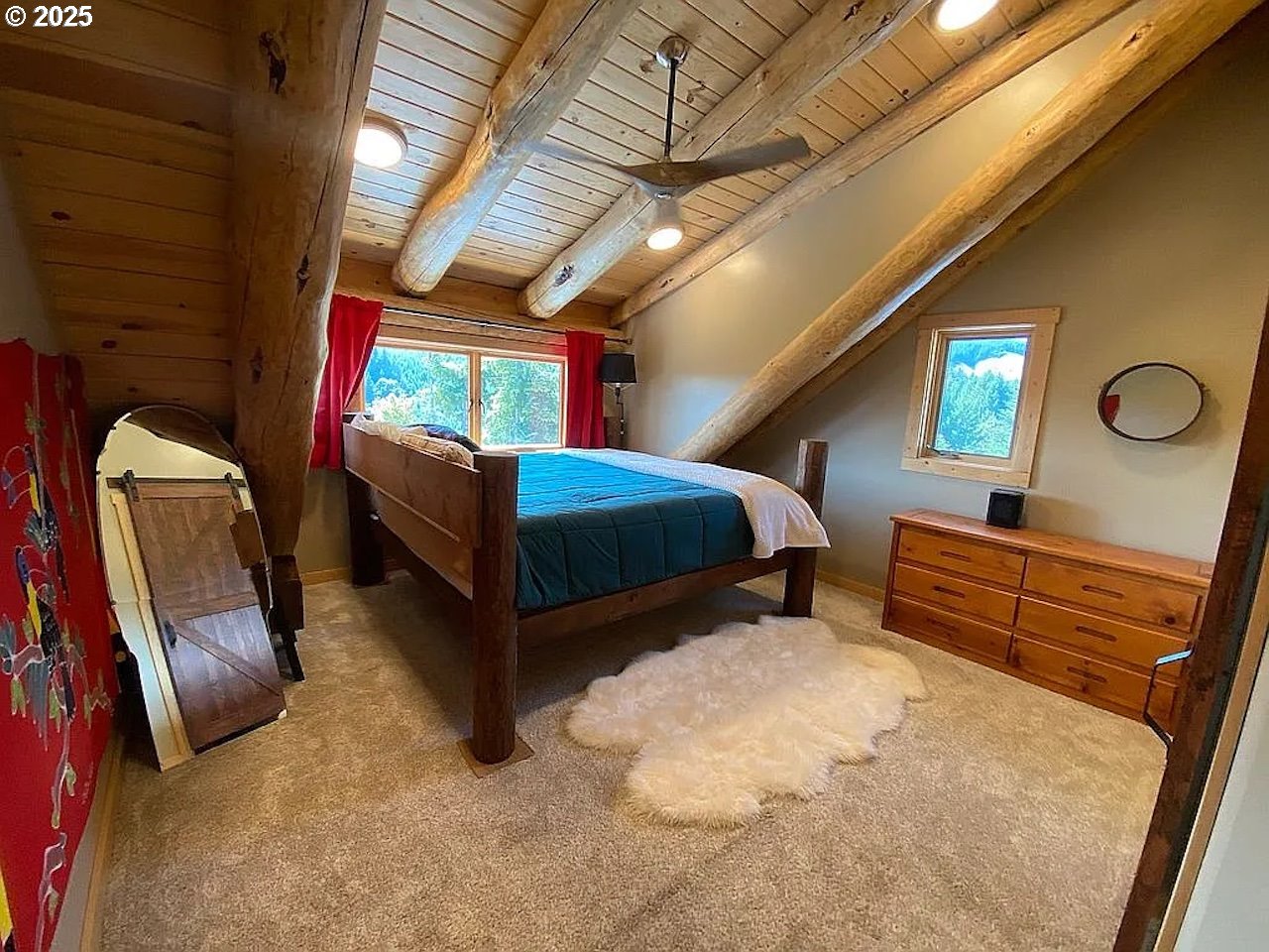 55778 Southwest Scoggins Valley Road Gaston, OR 97119 - Photo 11 of 42 a bedroom with furniture and a window