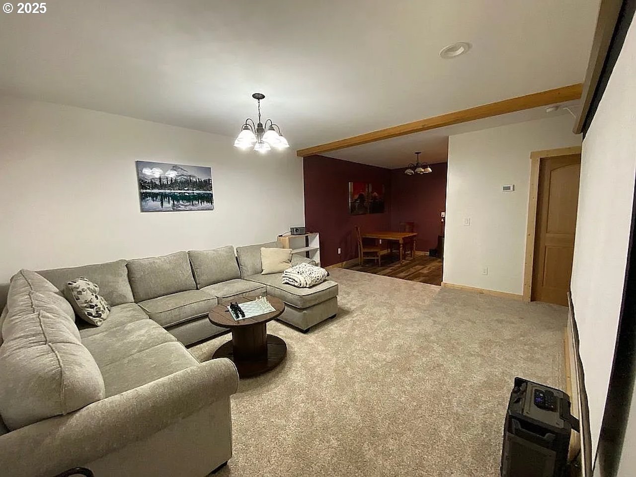 55778 Southwest Scoggins Valley Road Gaston, OR 97119 - Photo 12 of 42 a living room with furniture and a chandelier
