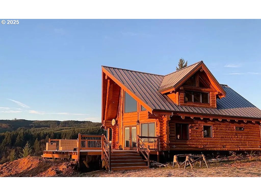 55778 Southwest Scoggins Valley Road Gaston, OR 97119 - Photo 2 of 42 a view of a house with a yard