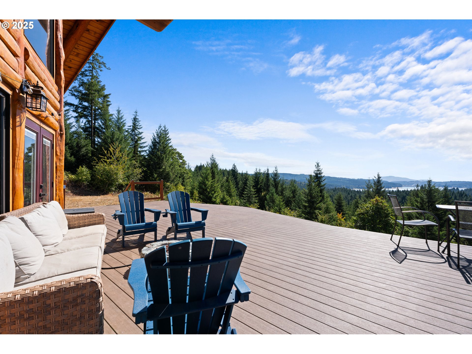 55778 Southwest Scoggins Valley Road Gaston, OR 97119 - Photo 28 of 42 a terrace of a house with outdoor seating