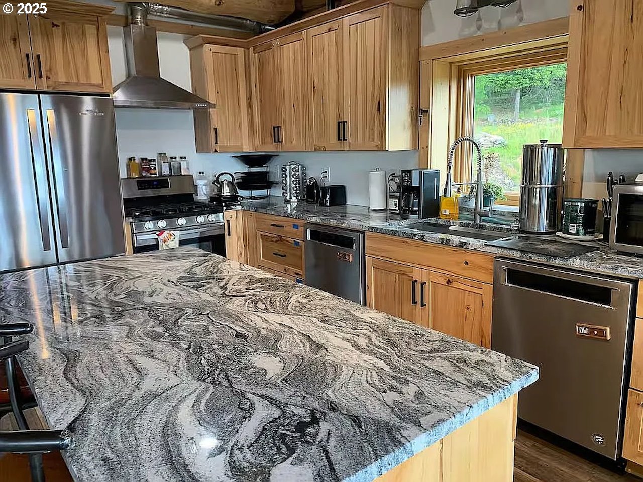 55778 Southwest Scoggins Valley Road Gaston, OR 97119 - Photo 3 of 42 a kitchen with stainless steel appliances granite countertop a stove a sink dishwasher and a refrigerator