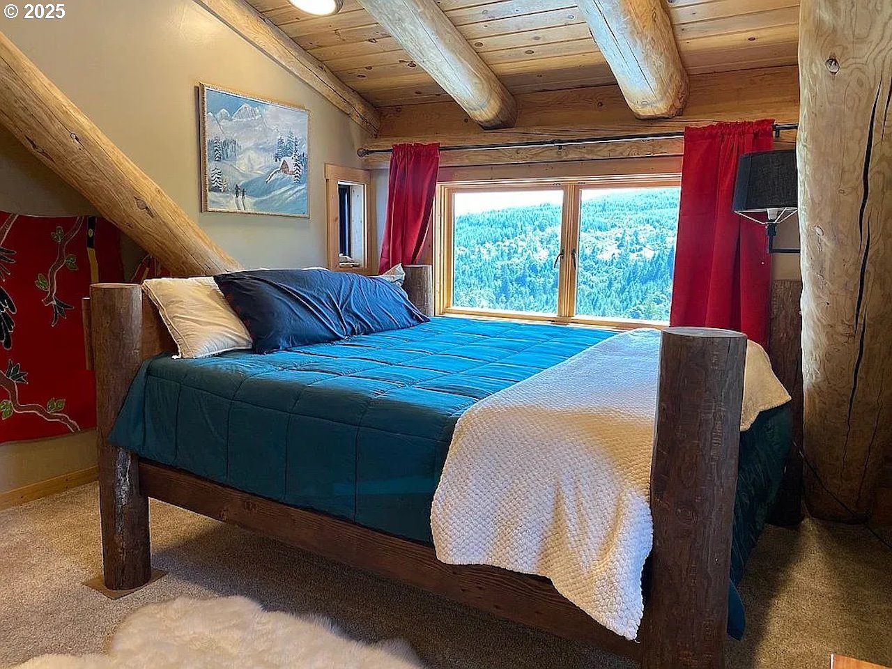 55778 Southwest Scoggins Valley Road Gaston, OR 97119 - Photo 10 of 42 a bed room with a bed and a large window