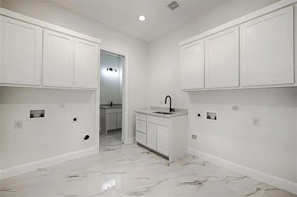 a view of a kitchen with electric appliances