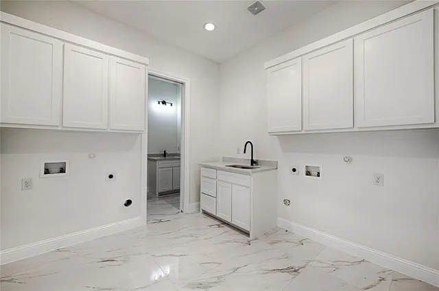 a view of a kitchen with electric appliances