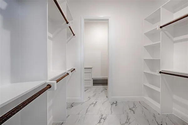 a view of an empty walk in closet