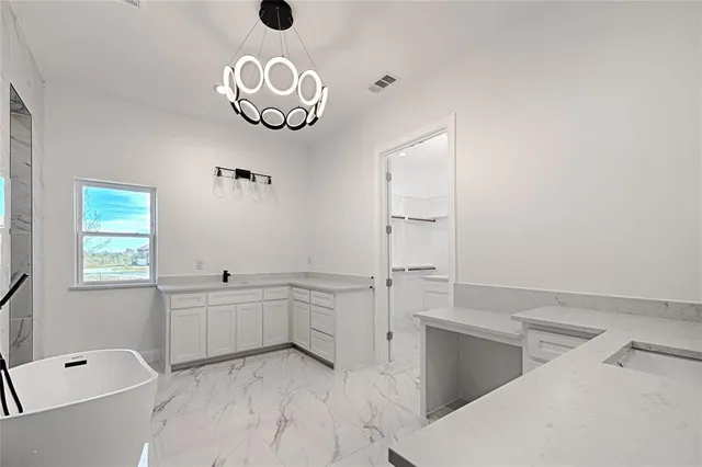 a bathroom with a tub and shower