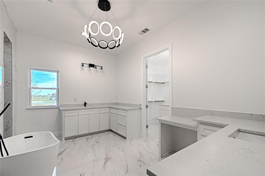 3611 Jacks Loop Midlothian, TX 76065 - Photo 22 of 39 a bathroom with a tub sink and mirror