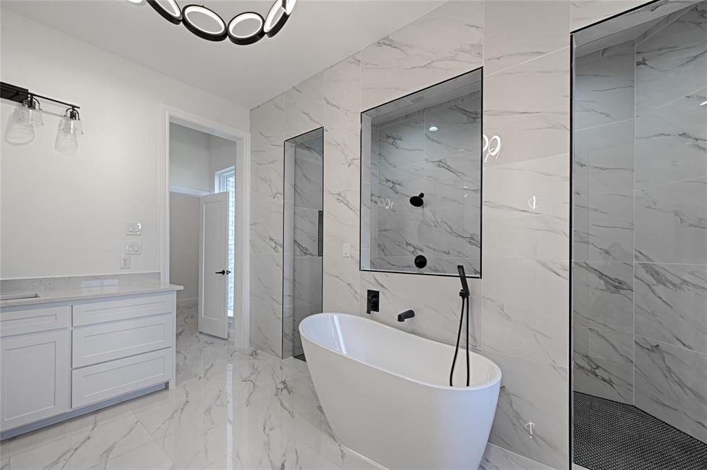 3611 Jacks Loop Midlothian, TX 76065 - Photo 23 of 39 a bathroom with a tub and shower