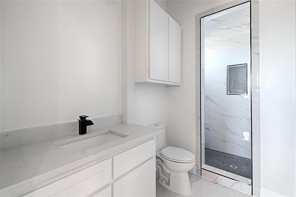 3611 Jacks Loop Midlothian, TX 76065 - Photo 27 of 39 a bathroom with a sink a toilet and shower