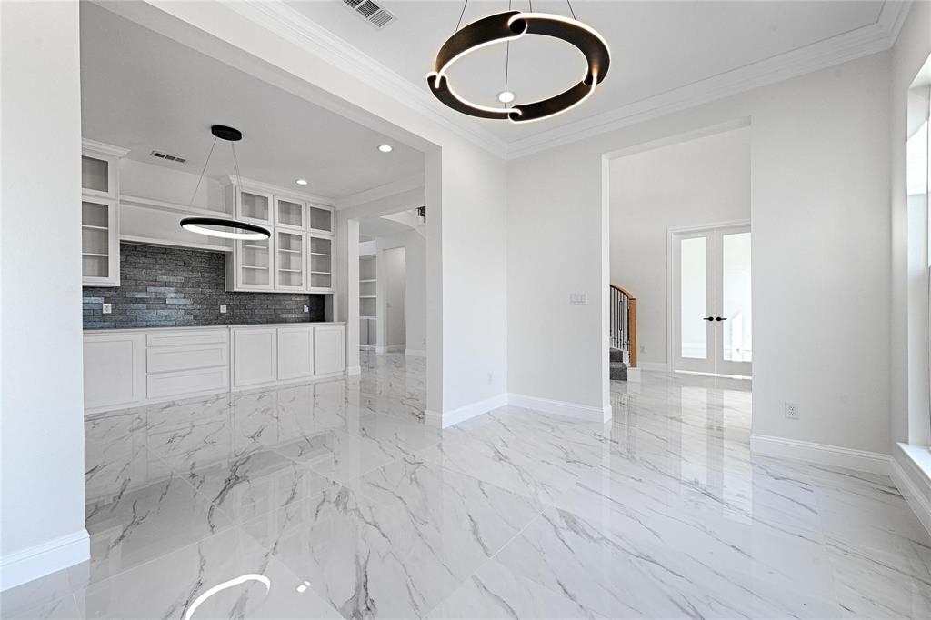 3611 Jacks Loop Midlothian, TX 76065 - Photo 7 of 39 a kitchen with stainless steel appliances granite countertop a stove a sink and a refrigerator