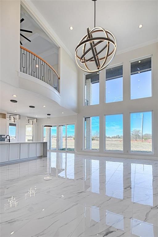 3611 Jacks Loop Midlothian, TX 76065 - Photo 9 of 39 a view of a hallway with entryway window and chandelier