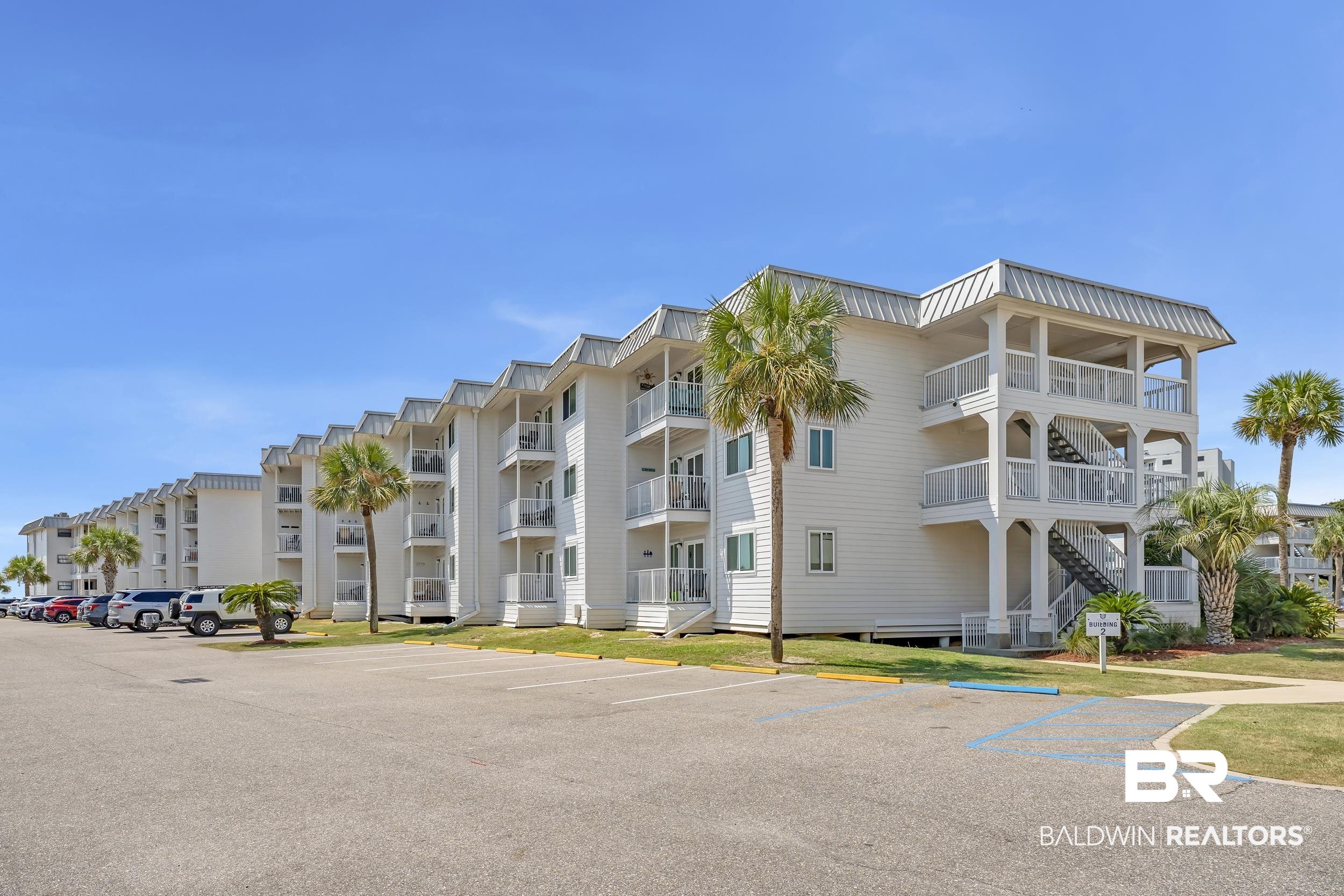 400 Plantation Road, Unit 2118 Gulf Shores, AL 36542 - Photo 41 of 59 Multi-story residential building featuring white siding and individual balconies