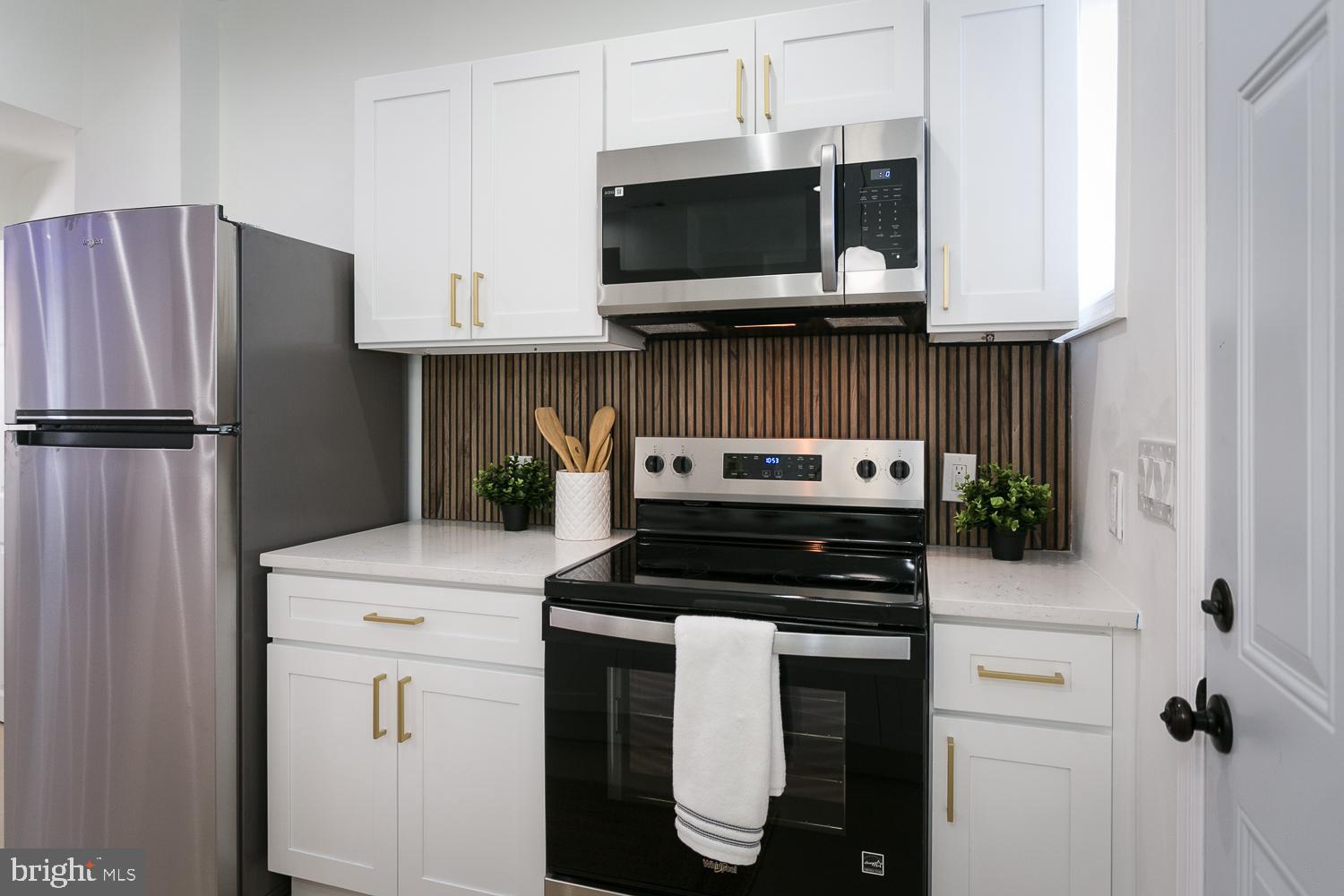 3729 Beehler Avenue Baltimore, MD 21215 - Photo 11 of 36 a kitchen with appliances and cabinets