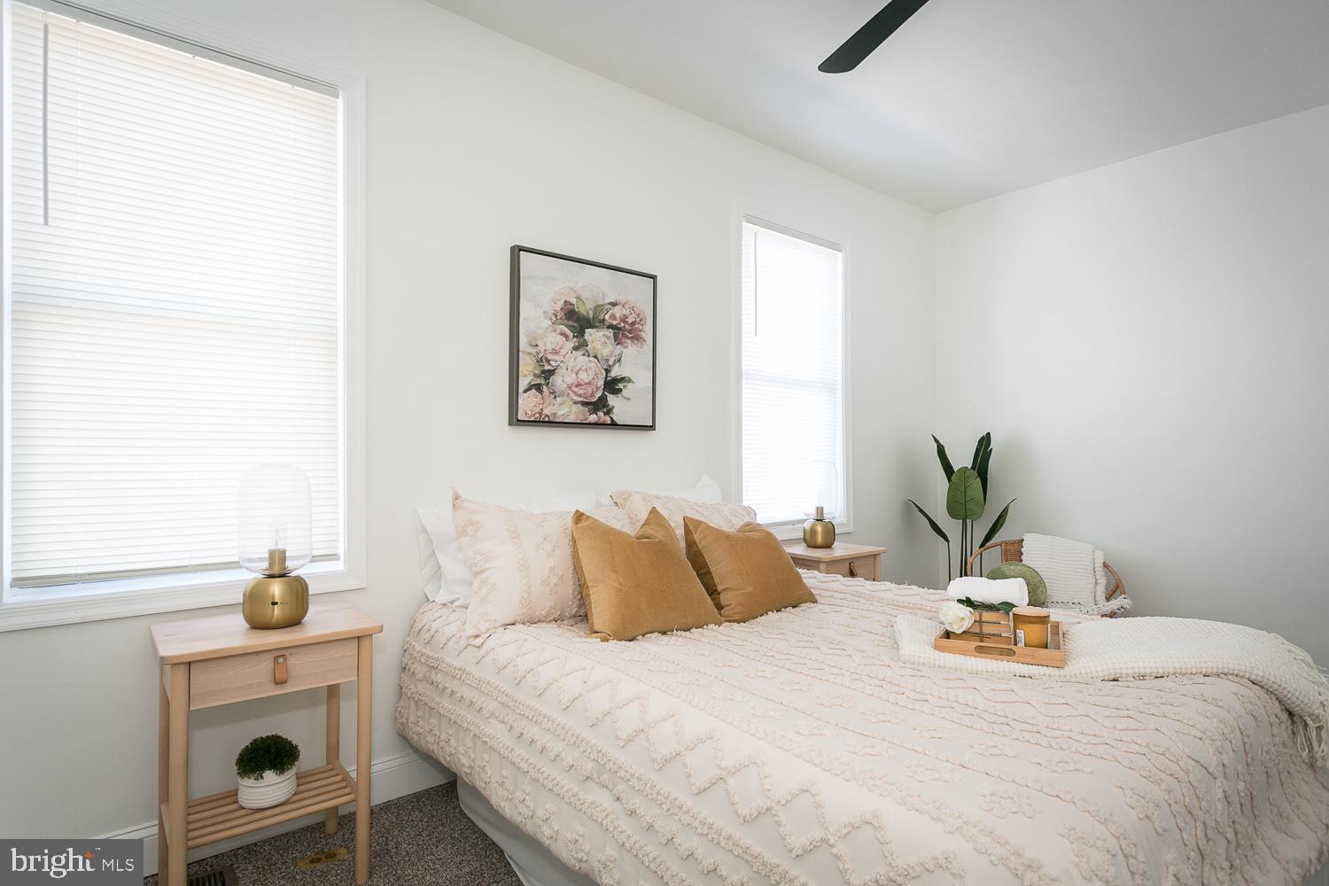 3729 Beehler Avenue Baltimore, MD 21215 - Photo 13 of 36 a bedroom with a bed and a painting on the wall