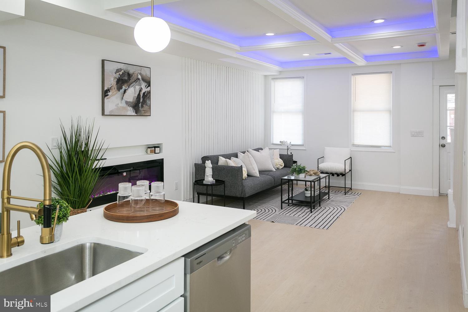 3729 Beehler Avenue Baltimore, MD 21215 - Photo 2 of 36 a living room with furniture and a potted plant